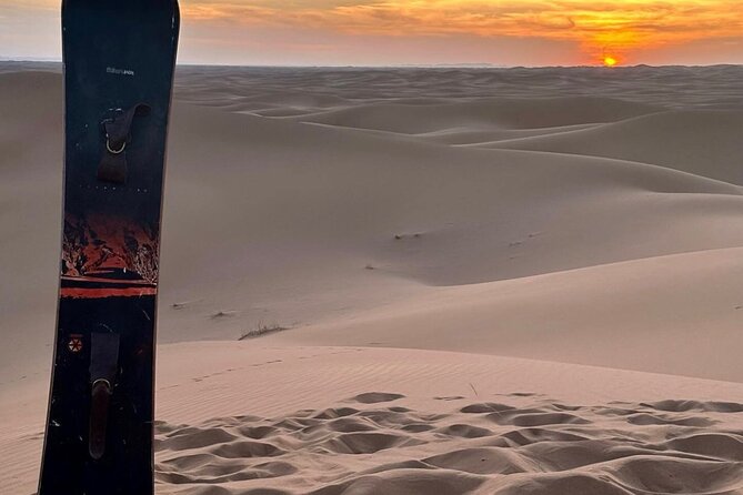 4hr Desert Safari: Sunset,Sunrise,Camel,Sand boarding,Inland Sea - Sand boarding from the high dunes