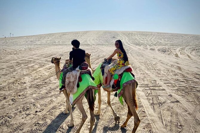 Camel trekking on the Dunes with Sunset - Sealine Beach and the first desert views