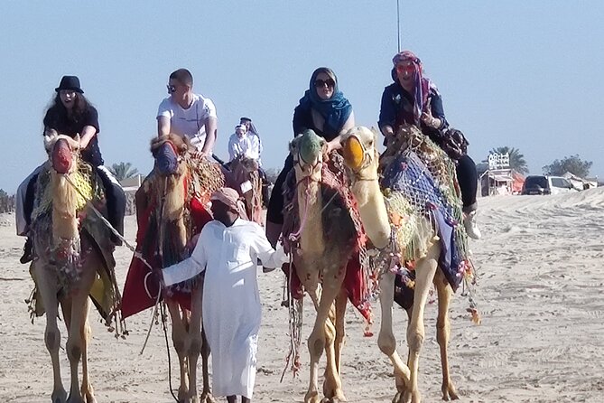 Desert Safari, Quad Bike, Sandboarding and Camel Ride - Sandboarding for a quick burst of fun