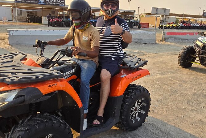 Desert Safari, Quad Bike, Sandboarding and Camel Ride - Quad biking on a designated track