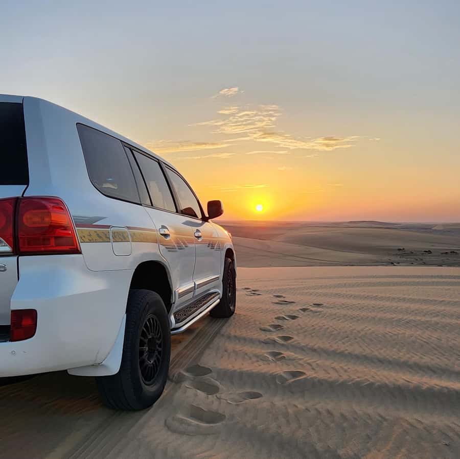 Doha: Desert Safari, Adventure, Sandboarding and Camel Ride - Photo stops, sunset, and the Inland Sea