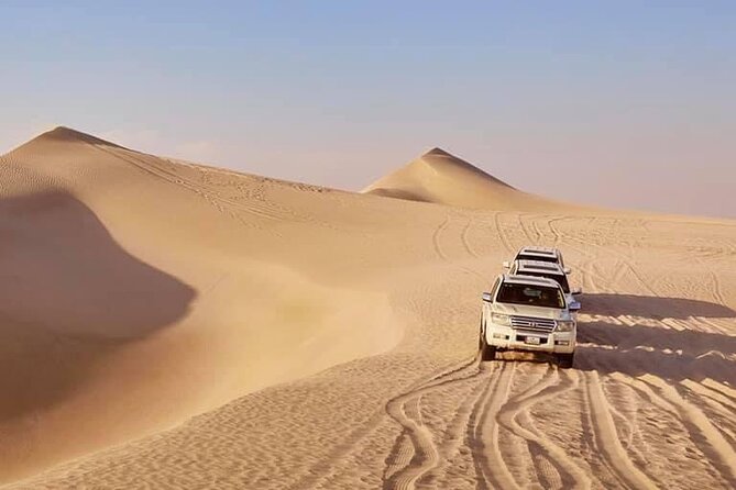 Doha: Desert Safari | Camel ride | Sand-boarding | Quad Biking - Quad biking across the open sand