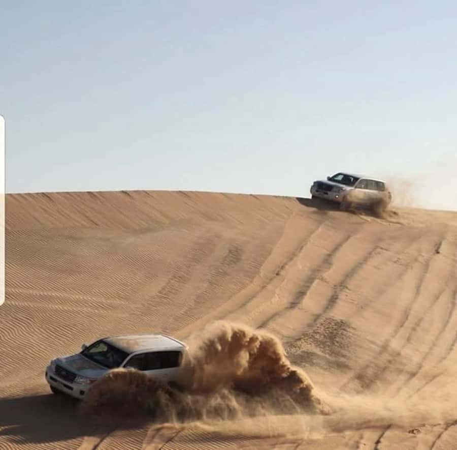 Doha: Desert Safari Dune Bashing, Sandboarding, & Camel Ride - Sandboarding without an extra charge