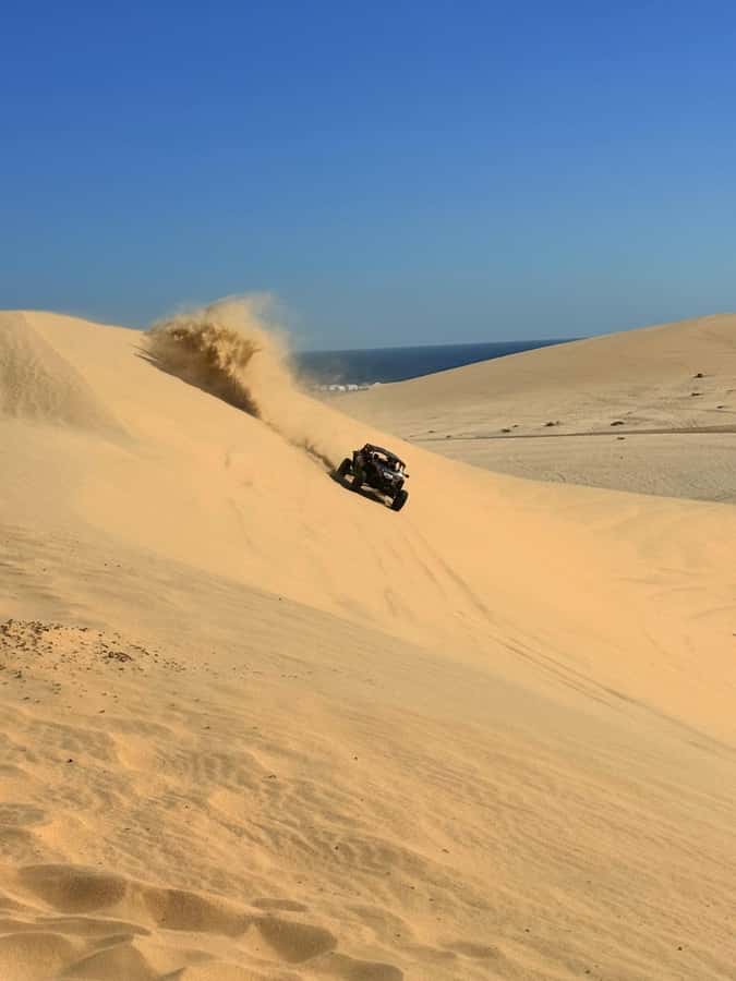Doha: Desert Safari, Quad Bike, Camel Ride & Inland Sea - Quad biking on a designated desert track