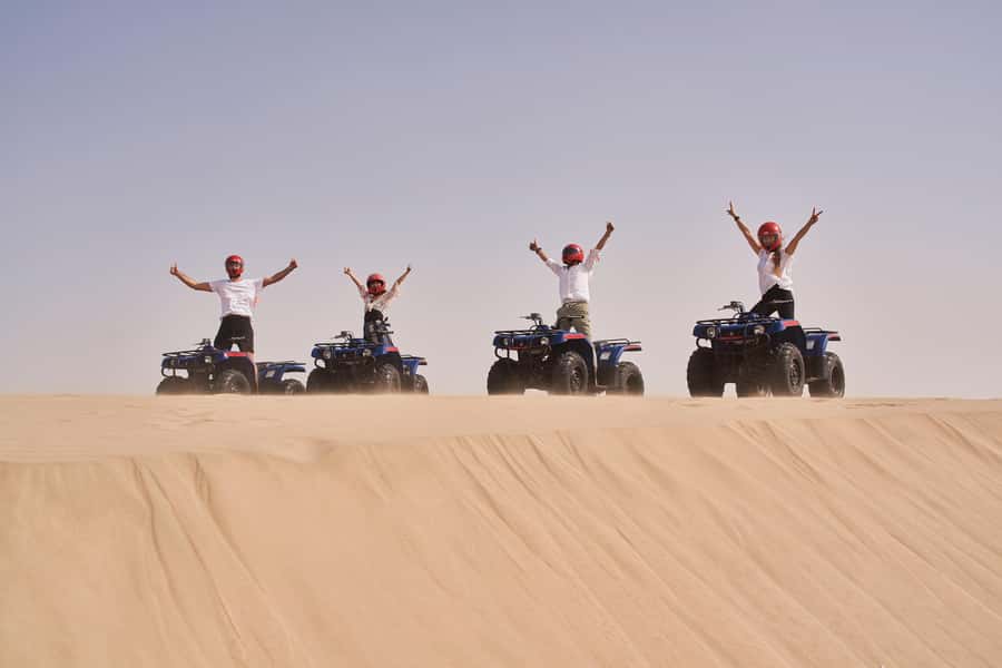 Doha: Desert Safari with Quad Bike, Sandboard & Camel Ride - Dune bashing in a 4WD Toyota