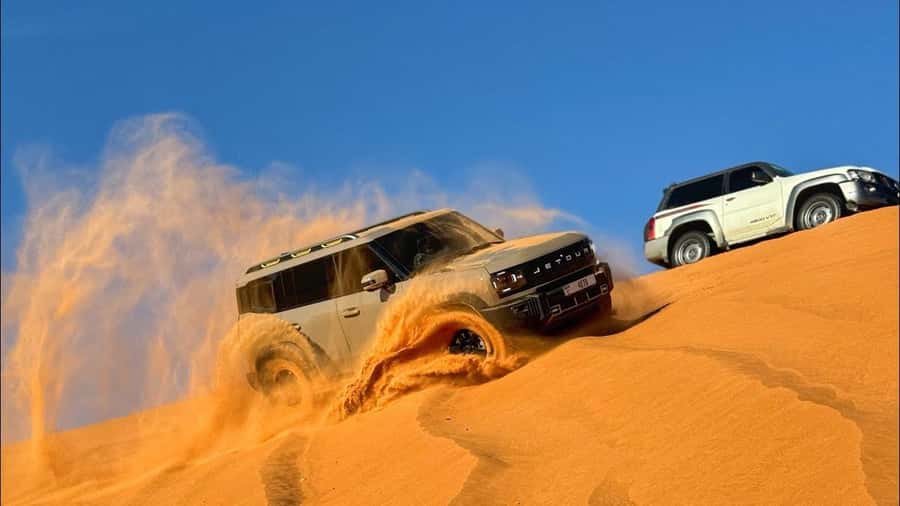 Doha: DesertSafari with Quad Bike, Camel Ride & Sandboarding - Sandboarding down the golden dunes