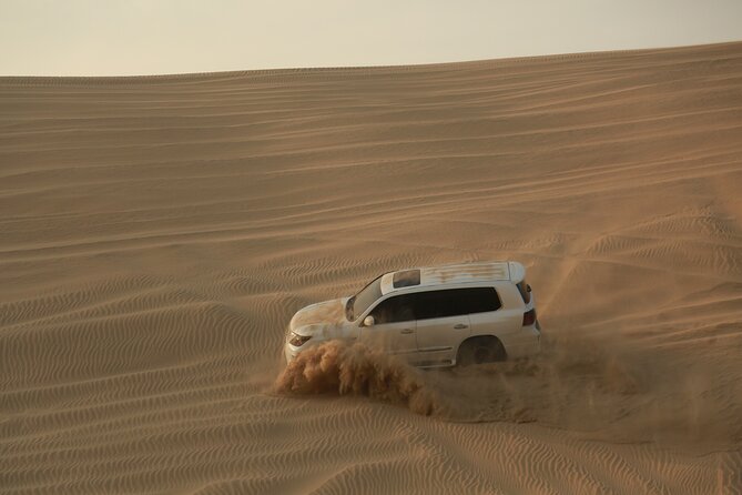 Doha: Half Day Desert Safari with Camel Ride and Inland Sea Tour - Sandboarding and desert photo stops