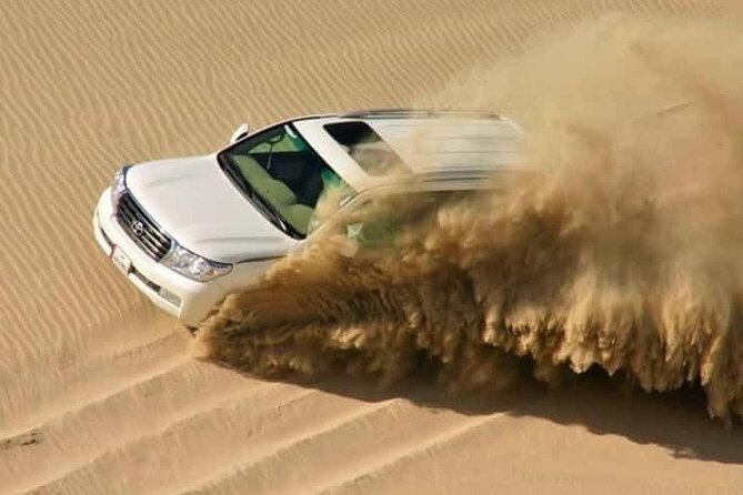 Doha: Half Day Desert Safari with Camel Ride and Inland Sea Tour - Dune bashing across the Sealine dunes