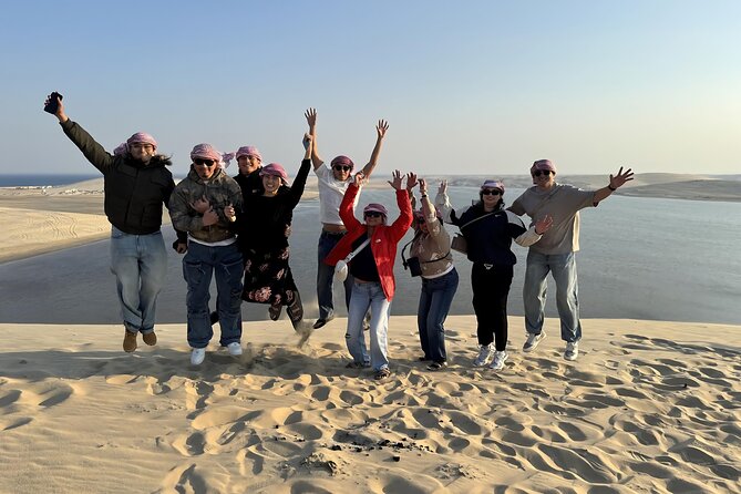 Doha: Luxury Desert Safari, Quad Bike & Sandboarding - Sandboarding from a high dune