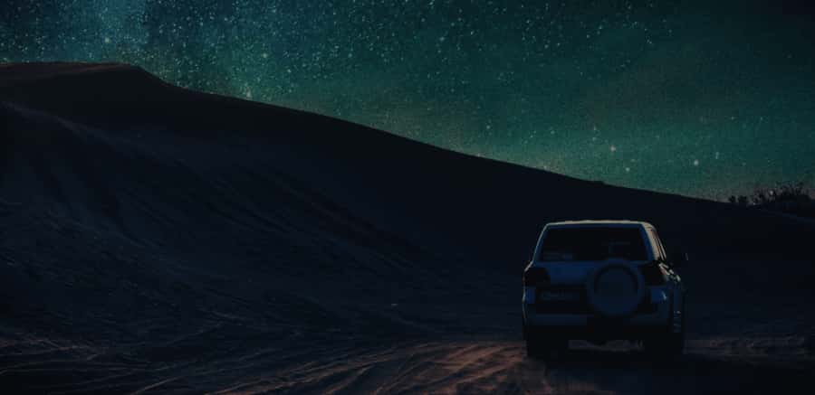 Doha: Night Desert Safari with Stargazing & Camel Ride - Dune bashing in a Toyota Land Cruiser