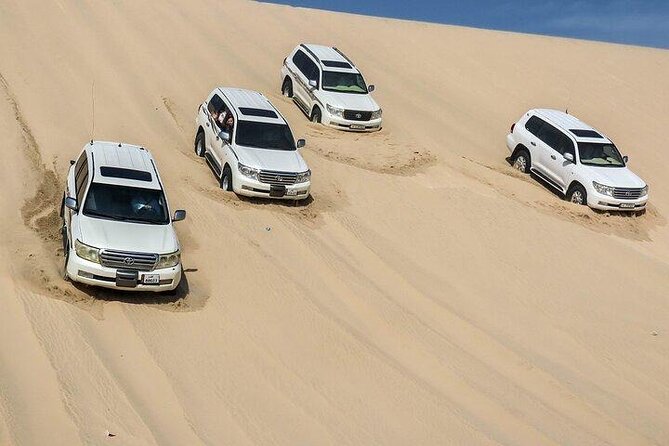 Doha Qatar ATV Quad Bike Buggy Desert Adventure and Camel Ride - Khor Al Adaid, where the sand meets the sea