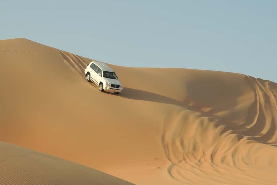 Doha Safari: ATV Ride, Dune Bashing, & Sandboarding Fun - Quad biking at Mesaieed