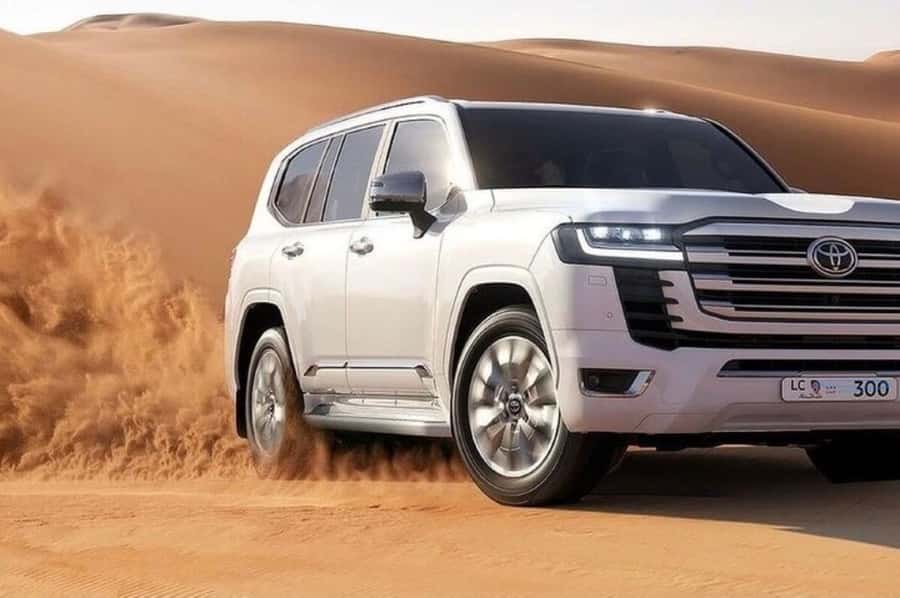Doha: Safari, Camel Ride, Sand boarding and Inland Sea Tour - Sandboarding down Qatar’s dunes