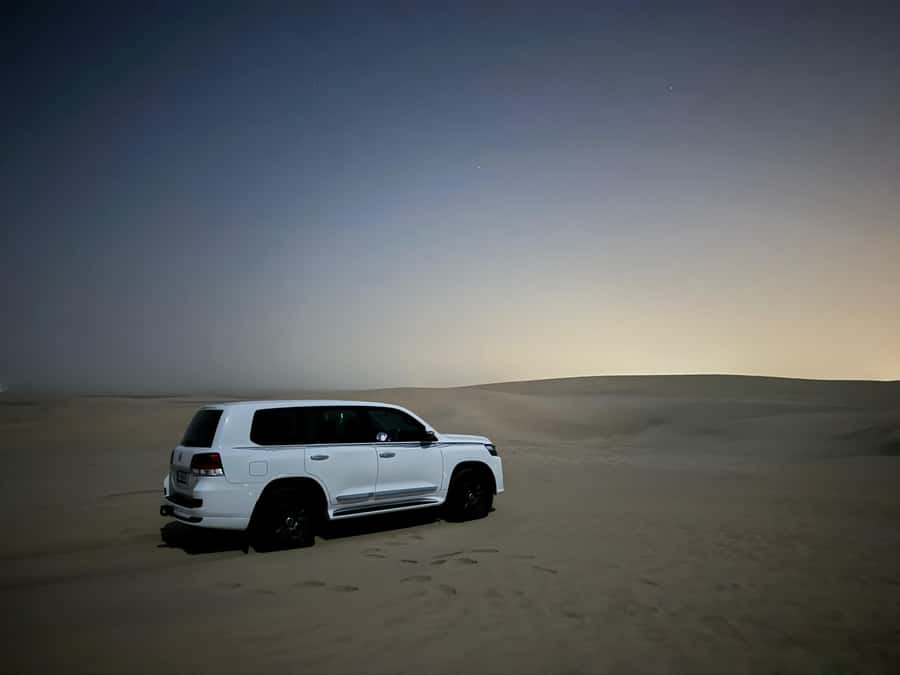 Doha: Stargazing Desert Safari w/ Dune Bashing & Camel Ride - Sandboarding keeps the active part family friendly