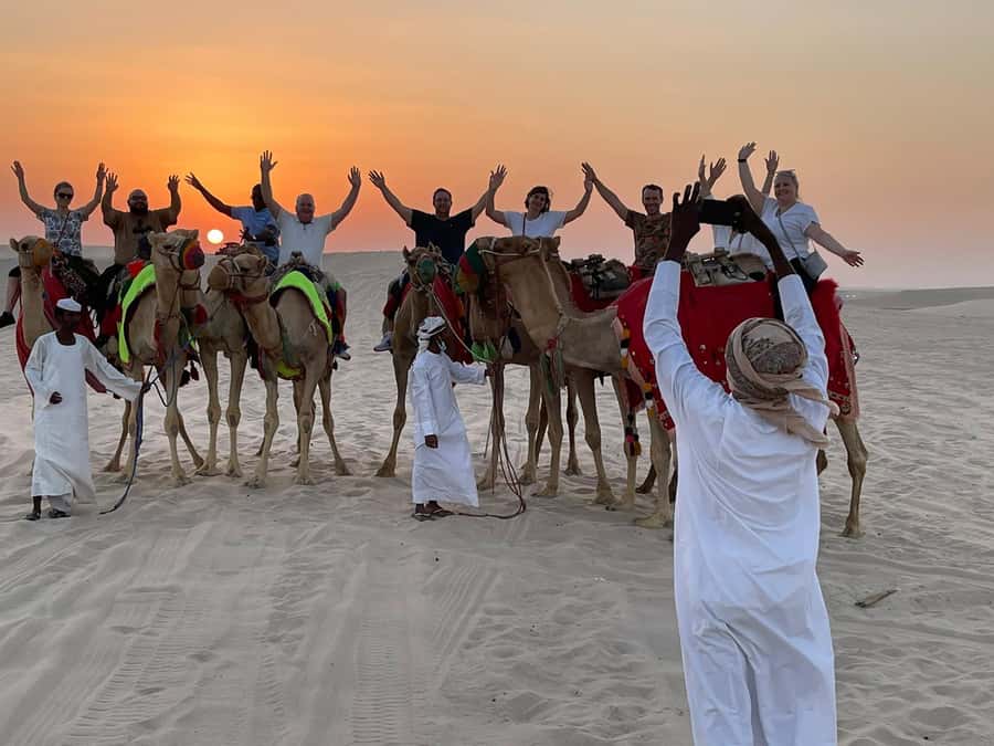 Doha: Sunset Safari, Dune Bashing, Sandboarding & Camel Ride - A short camel ride at the local camp