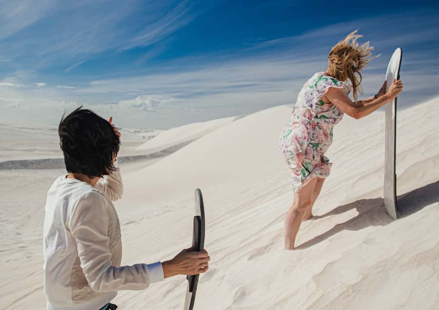 Dune Bashing, Sandboarding, Camel Ride & Optional ATV Ride - Sandboarding on the tall dunes