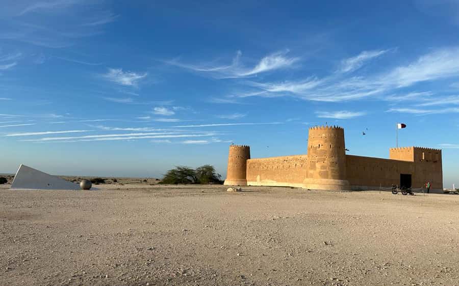 Explore North Qatar with history and archaeological sites. - Al Khor, boats, and the old coastal economy