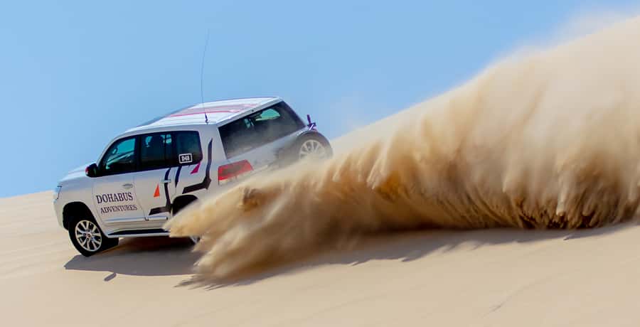 From Doha: 8-hour Safari Tour with Desert Beach Experience - The Inland Sea, where sand reaches the water