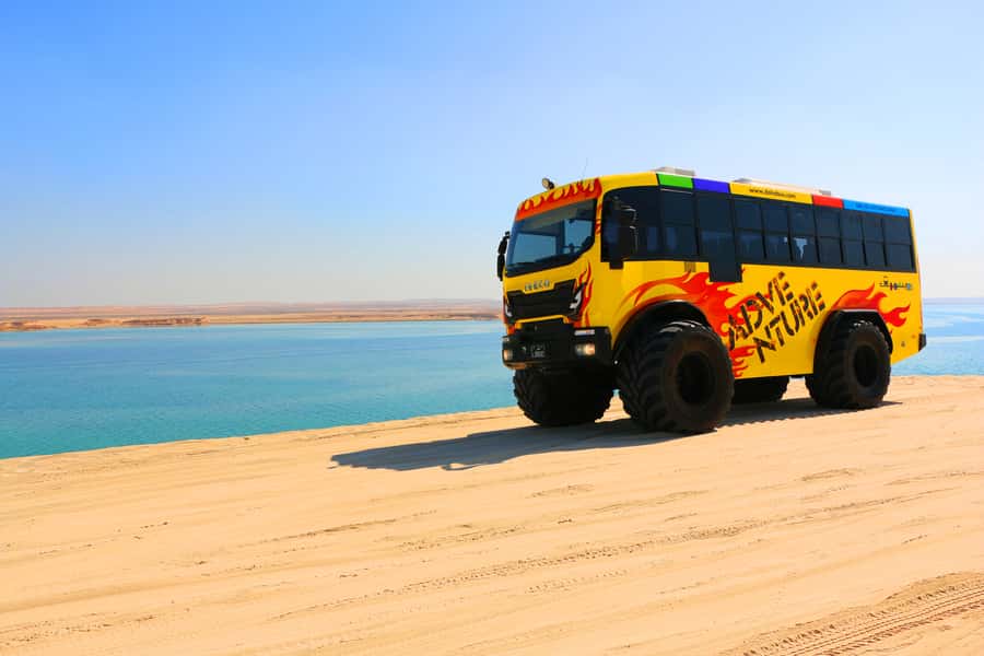 From Doha: Exclusive Monster Bus Safari Experience - Climbing the dunes in a 32-seat Monster Bus