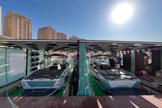 Private Wakesurfing or Wakeboarding along Doha's skyline - Who will get the most from this session
