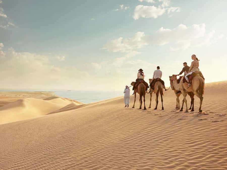 Qatar Desert Safari, Quad bike, Camel Ride and Sandboarding - The Inland Sea gives the safari its setting