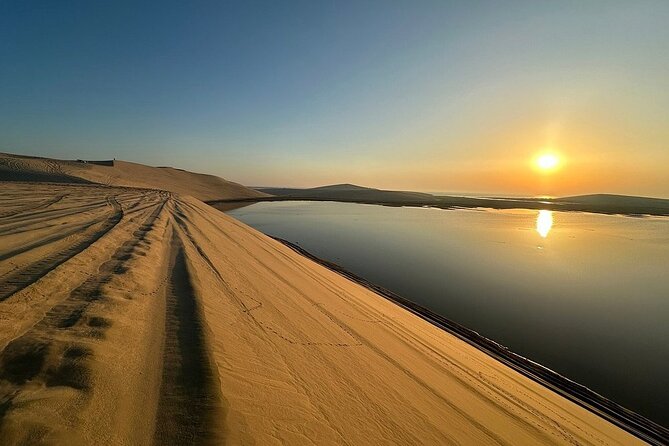 Qatar: Sunrise or Sunset Desert Tour in Doha, unforgettable trip - Sealine Beach: camel rides and tire pressure