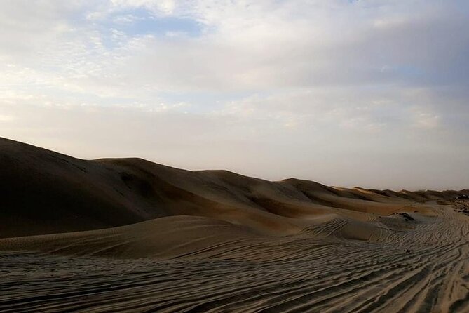 Qatar Sunset Desert Safari: Dune Bashing & Golden Sands Adventure - Sandboarding on Qatar’s soft slopes