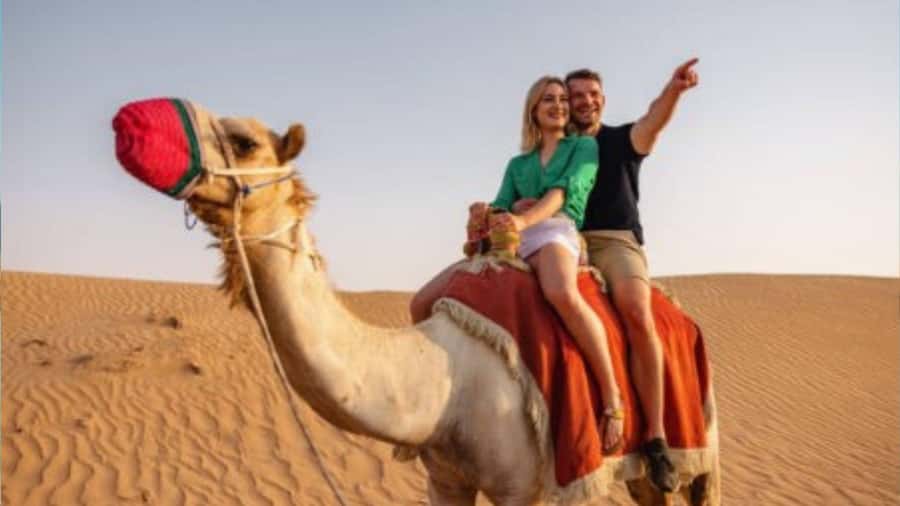 Sunrise/Sunset DuneBashing,CamelRide InlandSea &Sandboarding - A short camel ride with a traditional touch